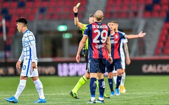 Giacomelli of Trieste (Referee match) shows yellow card to both Lorenzo De Silvestri (Bologna FC)