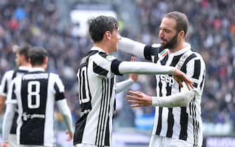 Juventus' Paulo Dybala (L) jubilates with his teammate Gonzalo Higuain after scoring the goal during the Italian Serie A soccer match Juventus FC vs Udinese Calcio at Allianz Stadium in Turin, Italy, 11 March 2018.
ANSA/ALESSANDRO DI MARCO