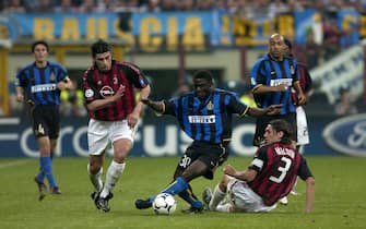 Milan  Italy  13 May 2003, "G.MEAZZA SAN SIRO " Stadium,  UEFA Champions League 2002/2003,  FC Inter - AC Milan : Obafemi Martins , Paolo Maldini and Kakhaber Kaladze in action during the match