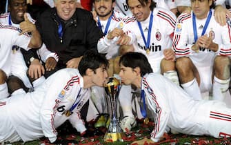 Italian club AC Milan's Kaka (L bottom) and Filippo Inzaghi (R bottom) kiss to the trophy as they celebrate their victory after beating Argentine club Boca Juniors in the FIFA Club World Cup final at Yokohama International Stadium, south of Tokyo, Japan, 16, December, 2007. ANSA/KIMIMASA MAYAMA