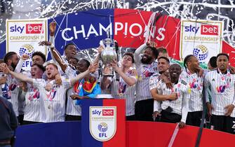 Fulham players celebrate with the Championship trophy after being crowned champions after the Sky Bet Championship match at Craven Cottage, London. Picture date: Monday May 2, 2022.