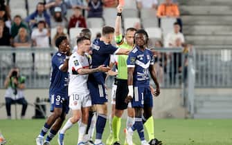 Bordeaux' Ghanaian defender Gideon Mensah (R) is shown a red card  during the French L1 football match between Girondins de Bordeaux and FC Lorient at the Matmut stadium in Bordeaux, southwestern France, on May 14, 2022 . (Photo by ROMAIN PERROCHEAU / AFP) (Photo by ROMAIN PERROCHEAU/AFP via Getty Images)