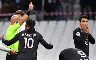 Lille's French midfielder Benjamin Andre (R) reacts as he receives a red card during the French L1 football match between Olympique Marseille (OM) and Lille OSC at the Velodrome Stadium in Marseille, southern France, on January 16, 2022. (Photo by Sylvain THOMAS / AFP) (Photo by SYLVAIN THOMAS/AFP via Getty Images)