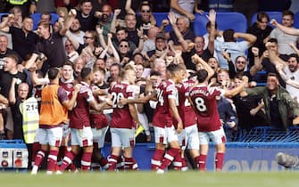 West Ham United's Michail Antonio celebrates scoring their side's first goal of the game with team-mates in front of the fans during the Premier League match at Stamford Bridge, London. Picture date: Saturday September 3, 2022.