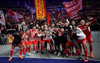 epa10436474 Union players celebrate winning the German Bundesliga soccer match between Hertha BSC and FC Union Berlin in Berlin, Germany, 28 January 2023.  EPA/CLEMENS BILAN (ATTENTION: The DFL regulations prohibit any use of photographs as image sequences and/or quasi-video.)