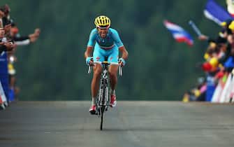 452149868 LA PLANCHE DES BELLES FILLES, FRANCE - JULY 14: Vincenzo Nibali of Italy and the Astana Pro Team crosses the finish line to win stage ten of the 2014 Tour de France, a 162km stage between Mulhouse and La Planche des Belles Filles, on July 14, 2014 in La Planche des Belles, France. (Photo by Bryn Lennon/Getty Images)