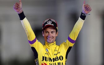epa07845427 Slovenian rider Primoz Roglic of Jumbo-Visma celebrates on the podium after winning the Vuelta a Espana cycling race, after the 21st and last stage of over 106.6km from Fuenlabrada to Madrid, Spain, 15 September 2019.  EPA/JAVIER LIZON
