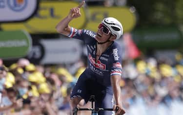Stage winner Team Alpecin Fenix' Mathieu van der Poel of Netherlands celebrates as he crosses the finish line at the end of the 2nd stage of the 108th edition of the Tour de France cycling race, 183 km between Perros-Guirrec and Mur de Bretagne Guerledan, on June 27, 2021. (Photo by STEPHANE MAHE / POOL / AFP) (Photo by STEPHANE MAHE/POOL/AFP via Getty Images)