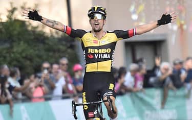 Slovenian Primoz Roglic celebrates his victory crossing the finish line of the 104th 'Giro dell'Emilia', Bologna, 2 October 2021. ANSA/BETTINI