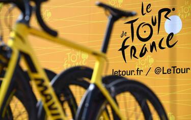 The official logo of the Tour de France is pictured behind bikes prior to the 207,5 km fourth stage of the 104th edition of the Tour de France cycling race on July 4, 2017 between Mondorf-les-Bains and Vittel. / AFP PHOTO / Lionel BONAVENTURE        (Photo credit should read LIONEL BONAVENTURE/AFP via Getty Images)