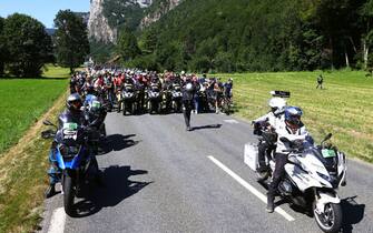 MEGEVE, FRANCE - JULY 12: A general view of the peloton stopped due to protesters in defending "Mont Blanc environment" blocking the route during the 109th Tour de France 2022, Stage 10 a 148,1km stage from Morzine to Megève 1435m / #TDF2022 / #WorldTour / on July 12, 2022 in Megeve, France. (Photo by Michael Steele/Getty Images)