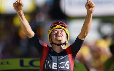 Ineos Grenadiers team's British rider Thomas Pidcock celebrates as he cycles past the finish line to win the 12th stage of the 109th edition of the Tour de France cycling race, 165,1 km between Briancon and L'Alpe-d'Huez, in the French Alps, on July 14, 2022. (Photo by Thomas SAMSON / AFP) (Photo by THOMAS SAMSON/AFP via Getty Images)