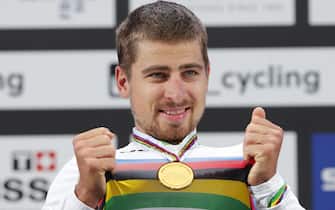 epa06224061 Peter Sagan of Slovakia celebrates on the podium after winning the Men's Elite Road Race at the UCI 2017 Road World Championship in Bergen, Norway, 24 September 2017.  EPA/CORNELIUS POPPE NORWAY OUT