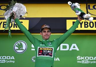Jumbo-Visma team's Belgian rider Wout Van Aert celebrates with the sprinter's green jersey on the podium after the 2nd stage of the 109th edition of the Tour de France cycling race, 202,2 km between Roskilde and Nyborg, in Denmark, on July 2, 2022. (Photo by Anne-Christine POUJOULAT / AFP) (Photo by ANNE-CHRISTINE POUJOULAT/AFP via Getty Images)