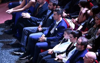 epa08198710 Portuguese soccer star and Juventus player, Cristiano Ronaldo (C) sits in the audience during the 70th Sanremo Italian Song Festival in Sanremo, Italy, 06 February 2020. The festival runs from 04 to 08 February.  EPA/ETTORE FERRARI