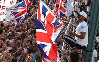 BUDAPEST, HUNGARY - AUGUST 04: Race winner Lewis Hamilton of Great Britain and Mercedes GP celebrates with fans after the F1 Grand Prix of Hungary at Hungaroring on August 04, 2019 in Budapest, Hungary. (Photo by Charles Coates/Getty Images)