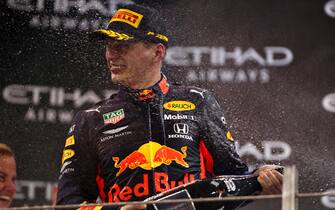 1191240483 ABU DHABI, UNITED ARAB EMIRATES - DECEMBER 01: Second placed Max Verstappen of Netherlands and Red Bull Racing celebrates on the podium during the F1 Grand Prix of Abu Dhabi at Yas Marina Circuit on December 01, 2019 in Abu Dhabi, United Arab Emirates. (Photo by Dan Istitene/Getty Images)
