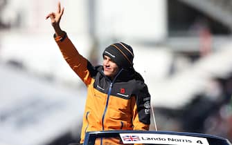 AUSTIN, TEXAS - NOVEMBER 03: Lando Norris of Great Britain and McLaren F1 waves to the crowd on the drivers parade before the F1 Grand Prix of USA at Circuit of The Americas on November 03, 2019 in Austin, Texas. (Photo by Charles Coates/Getty Images)
