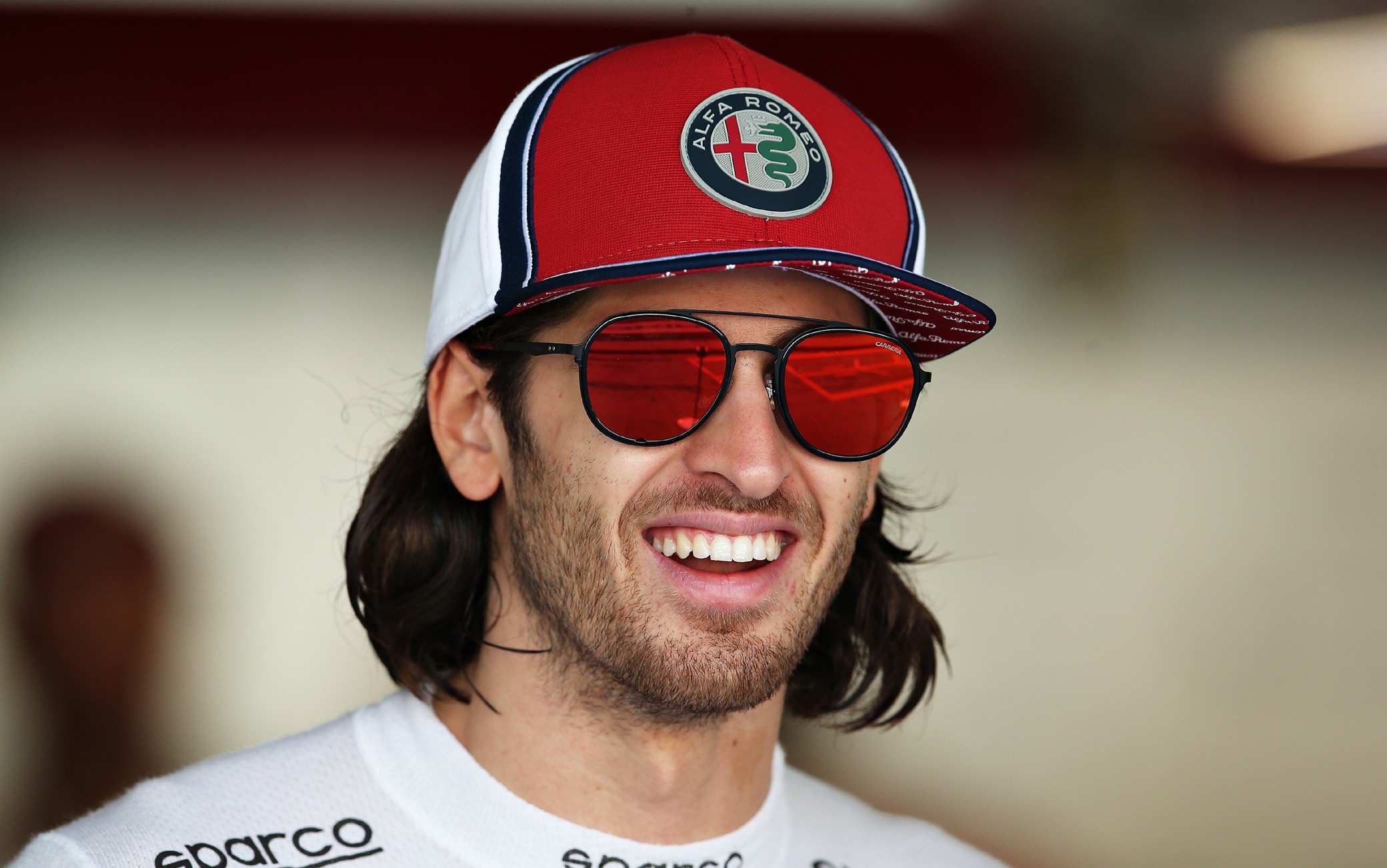1190794307 ABU DHABI, UNITED ARAB EMIRATES - NOVEMBER 29: Antonio Giovinazzi of Italy and Alfa Romeo Racing looks on in the garage before practice for the F1 Grand Prix of Abu Dhabi at Yas Marina Circuit on November 29, 2019 in Abu Dhabi, United Arab Emirates. (Photo by Charles Coates/Getty Images)