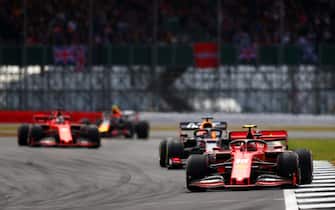NORTHAMPTON, ENGLAND - JULY 14: Charles Leclerc of Monaco driving the (16) Scuderia Ferrari SF90 leads Max Verstappen of the Netherlands driving the (33) Aston Martin Red Bull Racing RB15 on track during the F1 Grand Prix of Great Britain at Silverstone on July 14, 2019 in Northampton, England. (Photo by Dan Istitene/Getty Images)