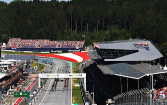 SPIELBERG, AUSTRIA - JUNE 30: A general view of the starting grid showing Charles Leclerc of Monaco driving the (16) Scuderia Ferrari SF90 and Max Verstappen of the Netherlands driving the (33) Aston Martin Red Bull Racing RB15 on the front row during the F1 Grand Prix of Austria at Red Bull Ring on June 30, 2019 in Spielberg, Austria. (Photo by Mark Thompson/Getty Images)