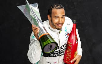 SHANGHAI, CHINA - APRIL 14: Race winner Lewis Hamilton of Great Britain and Mercedes GP celebrates on the podium during the F1 Grand Prix of China at Shanghai International Circuit on April 14, 2019 in Shanghai, China. (Photo by Mark Thompson/Getty Images)