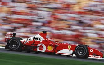 Michael Schumacher of Germany drives the #1 Scuderia Ferrari Marlboro Ferrari F2002 Ferrari V10 to victory in the Formula One German Grand Prix on 28 July 2002 at the Hockenheimring, Hockenheim, Germany.  (Photo by Darren Heath/Getty Images)