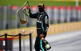SPIELBERG, AUSTRIA - JULY 12: Lewis Hamilton of Great Britain and Mercedes GP celebrates on the podium after winning the Formula One Grand Prix of Styria at Red Bull Ring on July 12, 2020 in Spielberg, Austria. (Photo by Bryn Lennon/Getty Images)