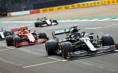 SILVERSTONE, UNITED KINGDOM - JULY 31: Lewis Hamilton, Mercedes F1 W11 EQ Performance, Charles Leclerc, Ferrari SF1000, and Valtteri Bottas, Mercedes F1 W11 EQ Performance, practice their start procedures during the British GP at Silverstone on Friday July 31, 2020 in Northamptonshire, United Kingdom. (Photo by Andy Hone / LAT Images)