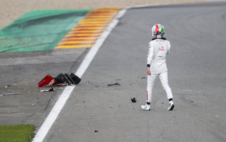 SPA-FRANCORCHAMPS, BELGIUM - AUGUST 30: Antonio Giovinazzi, Alfa Romeo, walks past the debris of his car on track after a collision during the Belgian GP at Spa-Francorchamps on Sunday August 30, 2020 in Spa, Belgium. (Photo by Zak Mauger / LAT Images)