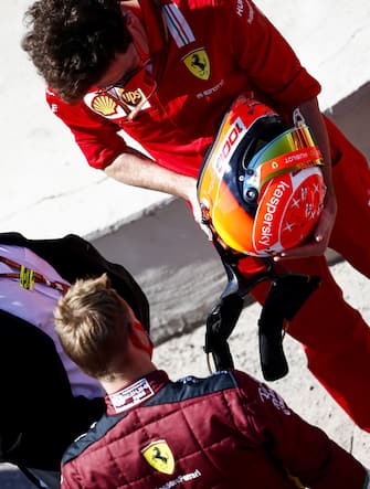 MUGELLO CIRCUIT, ITALY - SEPTEMBER 13: Mattia Binotto, Team Principal Ferrari, presents Mick Schumacher with a special helmet based on the design of his fathers, prior to him driving the championship winning Ferrari F2004 during the Tuscany GP at Mugello Circuit on Sunday September 13, 2020, Italy. (Photo by Andy Hone / LAT Images)
