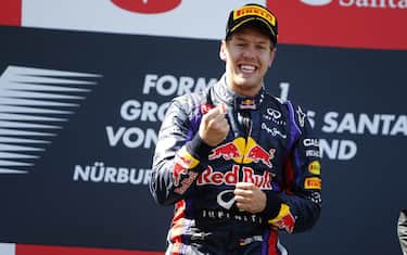 Nurburgring, Germany
7th July 2013
Sebastian Vettel, Red Bull Racing, 1st position, celebrates on the podium
World Copyright: Glenn Dunbar/LAT Photographic 
ref: Digital Image _89P9336