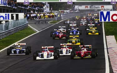 CIRCUITO ESTORIL, PORTUGAL - SEPTEMBER 26: Mika HÃ¤kkinen, McLaren MP4-8 Ford, leads Jean Alesi, Ferrari F93A, Ayrton Senna, McLaren MP4-8 Ford, and Alain Prost, Williams FW15C Renault, at the start during the Portuguese GP at Circuito Estoril on September 26, 1993 in Circuito Estoril, Portugal. (Photo by LAT Images)