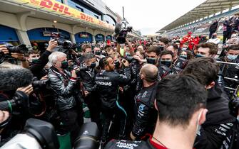 ISTANBUL PARK, TURKEY - NOVEMBER 15: Race Winner Lewis Hamilton, Mercedes-AMG Petronas F1 celebrates his 7th World Championship title in Parc Ferme with his team during the Turkish GP at Istanbul Park on Sunday November 15, 2020, Turkey. (Photo by Glenn Dunbar / LAT Images)