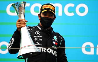 BUDAPEST, HUNGARY - JULY 19: Race winner Lewis Hamilton of Great Britain and Mercedes GP celebrates on the podium after the Formula One Grand Prix of Hungary at Hungaroring on July 19, 2020 in Budapest, Hungary. (Photo by Bryn Lennon/Getty Images)