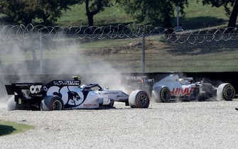 AlphaTauri's French driver Pierre Gasly (L) crashes with Haas F1's French driver Romain Grosjean during the Tuscany Formula One Grand Prix at the Mugello circuit in Scarperia e San Piero on September 13, 2020. (Photo by Luca Bruno / POOL / AFP) (Photo by LUCA BRUNO/POOL/AFP via Getty Images)
