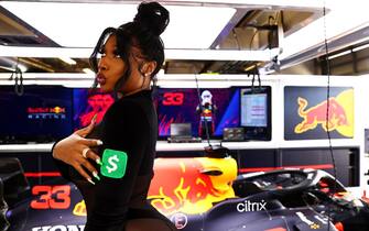 AUSTIN, TEXAS - OCTOBER 24: Megan Thee Stallion poses for a photo in the Red Bull Racing garage before the F1 Grand Prix of USA at Circuit of The Americas on October 24, 2021 in Austin, Texas. (Photo by Mark Thompson/Getty Images)