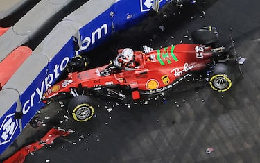 Ferrari's Monegasque driver Charles Leclerc reacts  after crashing during the second practice session of the Saudi Arabian Grand Prix at the Jeddah Corniche Circuit in Jeddah on December 3, 2021. (Photo by Giuseppe CACACE / AFP) (Photo by GIUSEPPE CACACE/AFP via Getty Images)