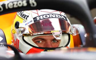 ABU DHABI, UNITED ARAB EMIRATES - DECEMBER 14: Max Verstappen of Netherlands and Red Bull Racing prepares to drive in the garage during Formula 1 testing at Yas Marina Circuit on December 14, 2021 in Abu Dhabi, United Arab Emirates. (Photo by Clive Rose/Getty Images)