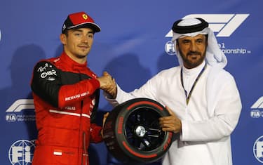 BAHRAIN INTERNATIONAL CIRCUIT, BAHRAIN - MARCH 19: Charles Leclerc, Ferrari, is presented with the Pole Position award by Mohammed bin Sulayem, President, FIA during the Bahrain GP at Bahrain International Circuit on Saturday March 19, 2022 in Sakhir, Bahrain. (Photo by Steven Tee / LAT Images)