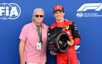 MIAMI INTERNATIONAL AUTODROME, UNITED STATES OF AMERICA - MAY 07: Michael Douglas presents Charles Leclerc, Ferrari, with the Pirelli Pole Position Award during the Miami GP at Miami International Autodrome on Saturday May 07, 2022 in Miami, United States of America. (Photo by Mark Sutton / Sutton Images)