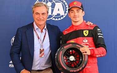 CIRCUIT DE BARCELONA-CATALUNYA, SPAIN - MAY 21: Charles Leclerc, Ferrari, receives his Pirelli pole position award from Carlos Sainz Snr during the Spanish GP at Circuit de Barcelona-Catalunya on Saturday May 21, 2022 in Barcelona, Spain. (Photo by Mark Sutton / Sutton Images)