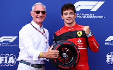 MONTE-CARLO, MONACO - MAY 28: Pole position qualifier Charles Leclerc of Monaco and Ferrari is presented with the Pirelli Pole Position trophy by Liberty CEO Greg Maffei during qualifying ahead of the F1 Grand Prix of Monaco at Circuit de Monaco on May 28, 2022 in Monte-Carlo, Monaco. (Photo by Eric Alonso/Getty Images)