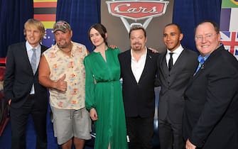 HOLLYWOOD, CA - JUNE 18:  (L-R) Actors Owen Wilson, Daniel Lawrence Whitney aka Larry the Cable Guy, Emily Mortimer, Eddie Izzard, Formula One racing driver Lewis Hamilton, and John Lasseter, Chief Creative Officer at Pixar and Walt Disney Animation Studios and director of 'Cars 2' attend the "Cars 2" Los Angeles Premiere at the El Capitan Theatre on June 18, 2011 in Hollywood, California.  (Photo by Lester Cohen/WireImage)