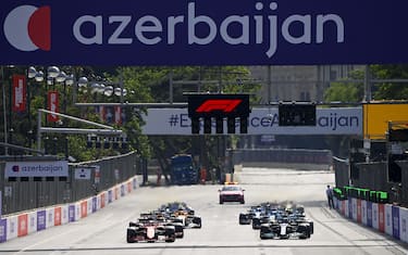 BAKU CITY CIRCUIT, AZERBAIJAN - JUNE 06: Charles Leclerc, Ferrari SF21, leads Sir Lewis Hamilton, Mercedes W12, Max Verstappen, Red Bull Racing RB16B, and the rest of the field away at the start during the Azerbaijan GP at Baku City Circuit on Sunday June 06, 2021 in Baku, Azerbaijan. (Photo by Mark Sutton / Sutton Images)