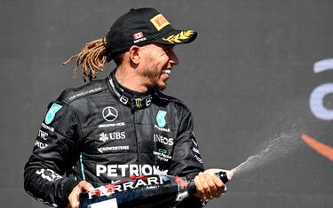 CIRCUIT GILLES-VILLENEUVE, CANADA - JUNE 19: Sir Lewis Hamilton, Mercedes-AMG, 3rd position, sprays Champagne on the podium during the Canadian GP at Circuit Gilles-Villeneuve on Sunday June 19, 2022 in Montreal, Canada. (Photo by Mark Sutton / Sutton Images)
