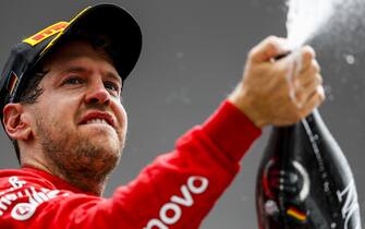 HOCKENHEIMRING, GERMANY - JULY 28: Sebastian Vettel, Ferrari, 2nd position, sprays Champagne on the podium during the German GP at Hockenheimring on July 28, 2019 in Hockenheimring, Germany. (Photo by Zak Mauger / LAT Images)