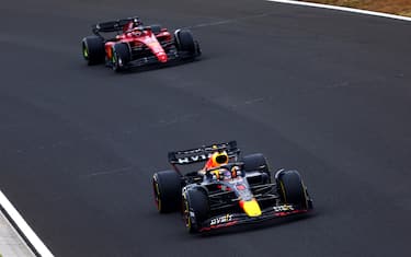 BUDAPEST, HUNGARY - JULY 31: Max Verstappen of the Netherlands driving the (1) Oracle Red Bull Racing RB18 leads Charles Leclerc of Monaco driving the (16) Ferrari F1-75 during the F1 Grand Prix of Hungary at Hungaroring on July 31, 2022 in Budapest, Hungary. (Photo by Dan Istitene - Formula 1/Formula 1 via Getty Images)