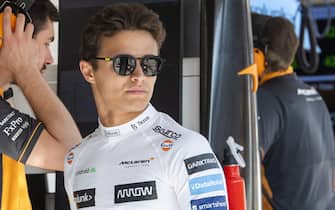 epa10097469 McLaren driver Lando Norris of Britain reacts in the paddock during the second practice session of the Formula One Grand Prix on the Hungaroring circuit in Mogyorod, Hungary, 29 July 2022. The Formula One Grand Prix of Hungary will take place on 31 July 2022.  EPA/Zoltan Balogh HUNGARY OUT