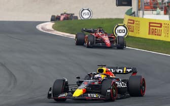 CIRCUIT ZANDVOORT, NETHERLANDS - SEPTEMBER 04: Max Verstappen, Red Bull Racing RB18, leads Charles Leclerc, Ferrari F1-75, and Carlos Sainz, Ferrari F1-75 during the Dutch GP at Circuit Zandvoort on Sunday September 04, 2022 in North Holland, Netherlands. (Photo by Alastair Staley / LAT Images)